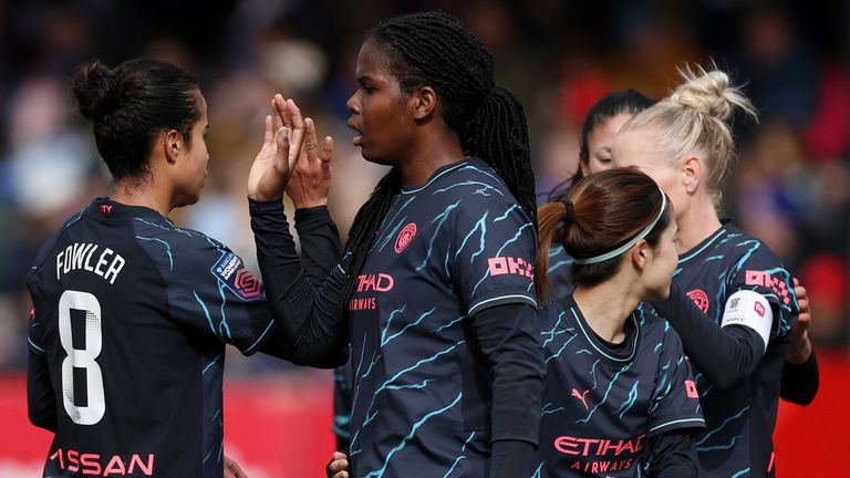 Khadija Shaw celebrates after scoring Manchester City's third goal at Brighton
