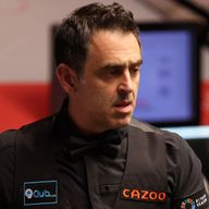 Ronnie O'Sullivan chalks the cue against Ryan Day in their round two match during day nine of the Cazoo World Snooker Championship 2024