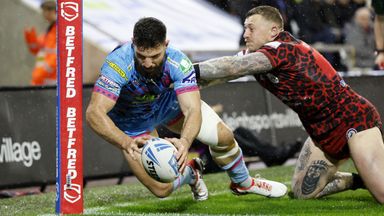 Leigh Leopards v Wigan Warriors - Betfred Super League - Leigh Sports Village
Wigan Warriors' Abbas Miski (left) scores their side's first try of the game during the Betfred Super League match at Leigh Sports Village, Leigh.</p data-src=