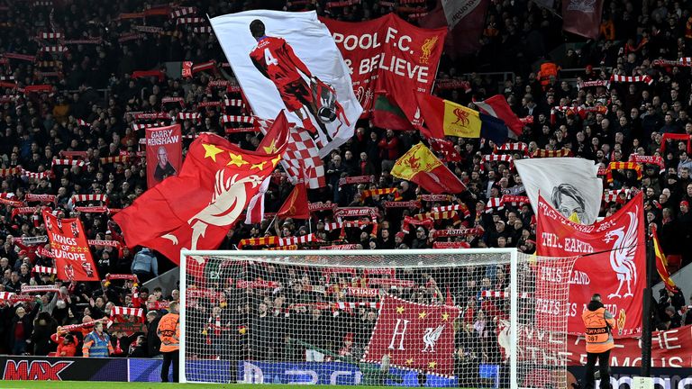 LIVERPOOL, ENGLAND - FEBRUARY 21: (THE SUN OUT, THE SUN ON SUNDAY OUT) Fans of Liverpool holding banners and flags in the Kop stand before the UEFA Champions League round of 16 leg one match between Liverpool FC and Real Madrid at Anfield on February 21, 2023 in Liverpool, England. (Photo by Andrew Powell/Liverpool FC via Getty Images)