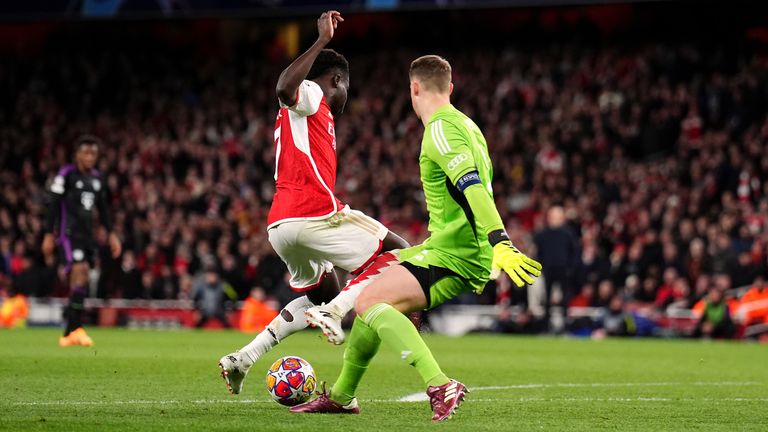 Arsenal's Bukayo Saka goes down under the challenge from Bayern Munich goalkeeper Manuel Neuer during the UEFA Champions League quarter-final, first leg match at the Emirates Stadium, London. Picture date: Tuesday April 9, 2024.