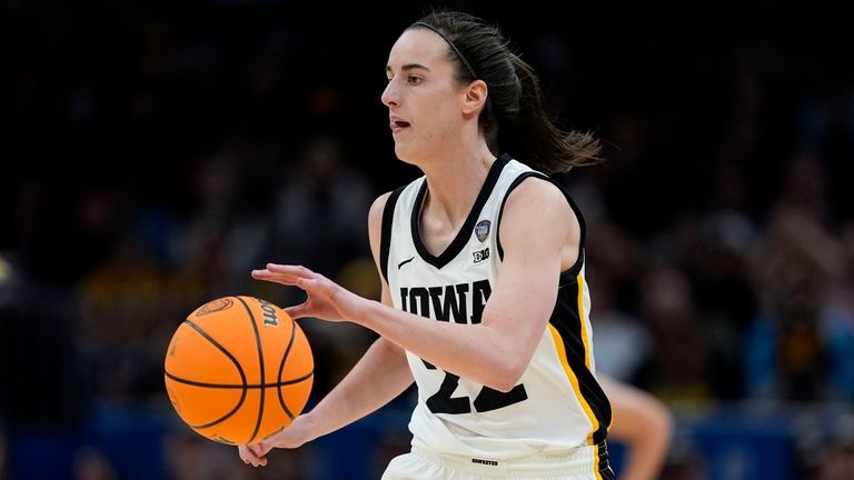 Iowa guard Caitlin Clark drives up court during the first half of a Final Four college basketball game against UConn in the women's NCAA Tournament, Friday, April 5, 2024, in Cleveland. (AP Photo/Carolyn Kaster)
