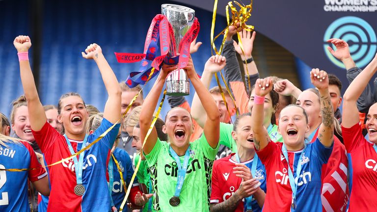 Crystal Palace goalkeeper Fran Kitching lifts the Women's Championship title