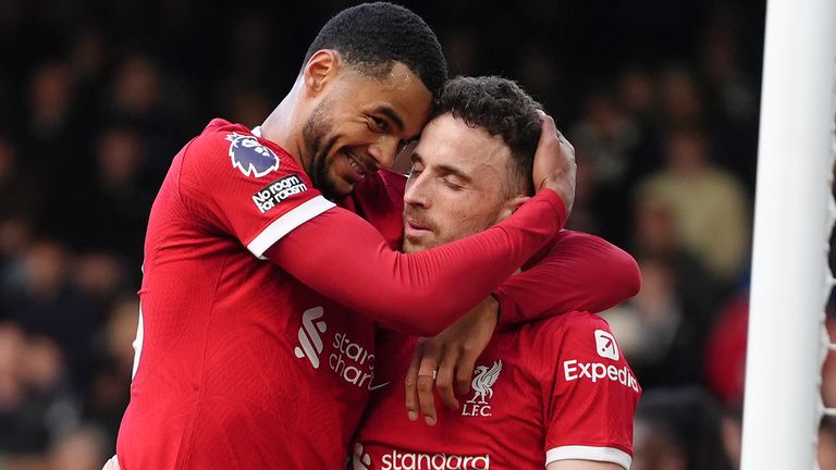 Diogo Jota celebrates with Cody Gakpo after scoring Liverpool's third