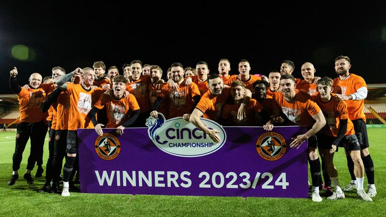 Dundee United players and staff celebrate winning the cinch Championship title
