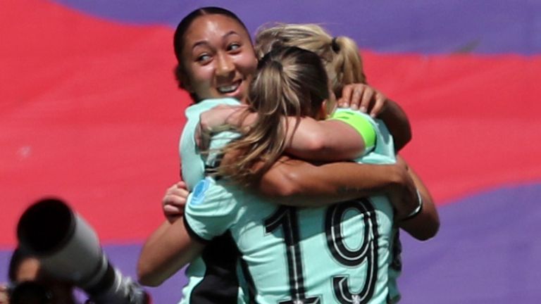 Erin Cuthbert and her Chelsea team-mates celebrate her winning goal in Barcelona