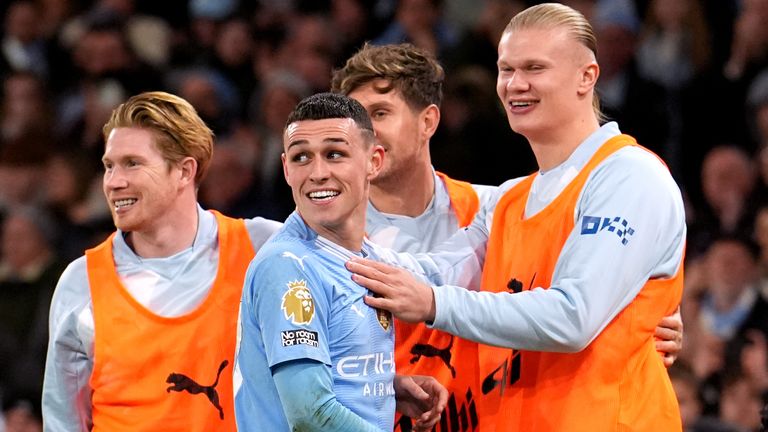 Foden celebrates with Kevin de Bruyne, John Stones and Erling Haaland, who were all rested