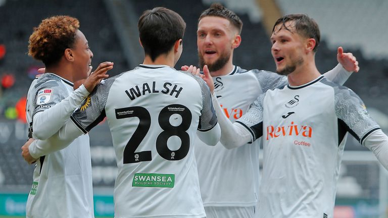 Jordi Govea, Liam Walsh, Matt Grimes and Liam Cullen celebrate after Swansea take the lead against Rotherham via an own goal