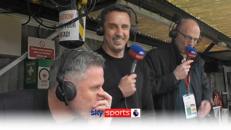 Gary Neville grins next to Jamie Carragher after Bruno Fernandes' goal against Liverpool.