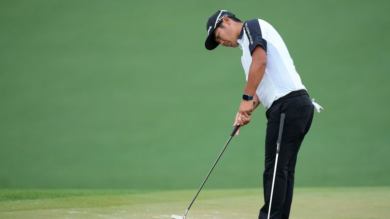 Ryo Histasune, of Japan, putts on the second hole during a practice round in preparation for the Masters golf tournament at Augusta National Golf Club