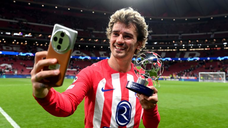 Antoine Griezmann takes a selfie after winning the player of the match