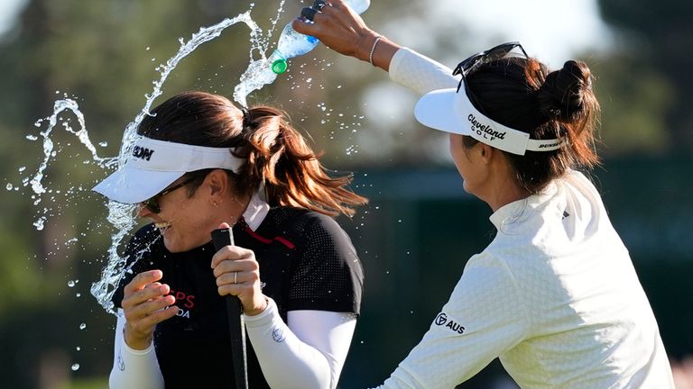 Grace Kim, right, sprayed water on Hannah Green in celebration after she won the JM Eagle LA Championship