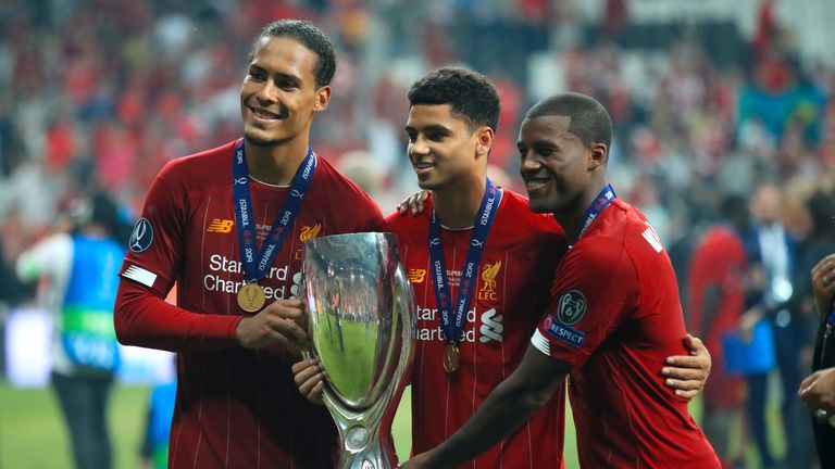 (left to right) Liverpool's Virgil van Dijk, Ki-Jana Hoever and Georginio Wijnaldum celebrate with the trophy after their side win the UEFA Super Cup Final at Besiktas Park, Istanbul. PRESS ASSOCIATION Photo. Picture date: Wednesday August 14, 2019. See PA story SOCCER Super Cup. Photo credit should read: Adam Davy/PA Wire
