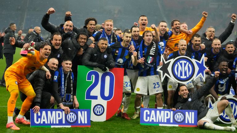 Inter Milan players celebrate after winning the Serie A title