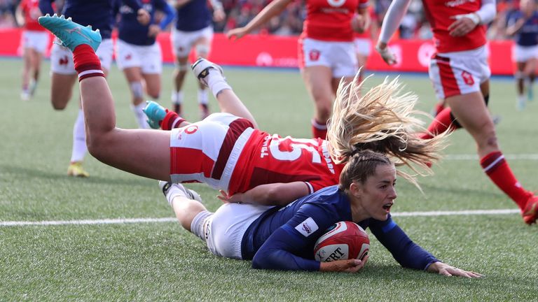 France's wing Joanna Grisez scores the team's sixth try during the Six Nations international women's rugby union match between Wales and France at Cardiff Arms Park in Cardiff, south Wales on April 21, 2024. (Photo by Geoff Caddick / AFP)