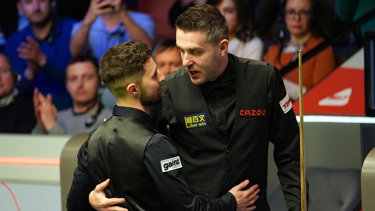 Joe O'Connor celebrates beating Mark Selby (right) on day three of the 2024 Cazoo World Snooker Championship at the Crucible Theatre, Sheffield. Picture date: Monday April 22, 2024.