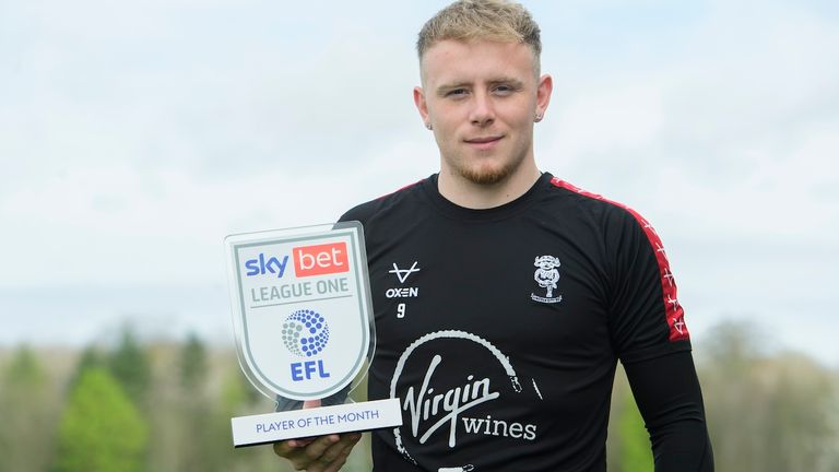 Lincoln City's Joe Taylor, photographed at the club...s BMW Soper of Lincoln Elite Performance Centre, with the Sky Bet League One Player of the Month trophy for March 2024...Picture: Chris Vaughan Photography for Lincoln City FC.Date: April 11, 2024