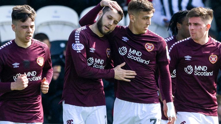 PAISLEY, SCOTLAND - APRIL 06: Jorge Grant celebrates with Kenneth Vargas after scoring during a thrilling Premiership match between St Mirren and Heart of Midlothian at the SMiSA Stadium in Paisley, Scotland on April 06, 2024 in Paisley, Scotland. made the score 1-0 for Hearts.  (Photo by Craig Williamson / SNS Group)