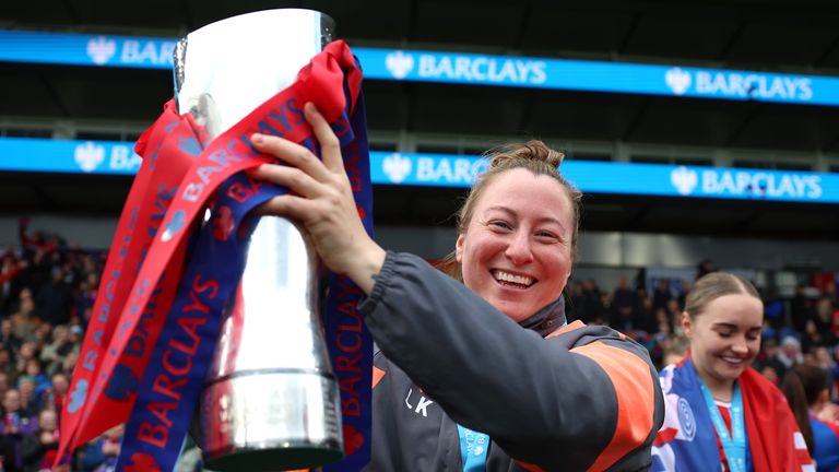 Crystal Palace manager Laura Kaminski lifts the Women's Championship title
