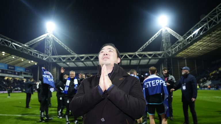 Leicester City chairman Aiyawatt Srivaddhanaprabha celebrates with the fans on the pitch