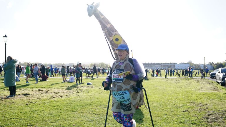 A competitor dressed as a giraffe in Blackheath before the TCS London Marathon