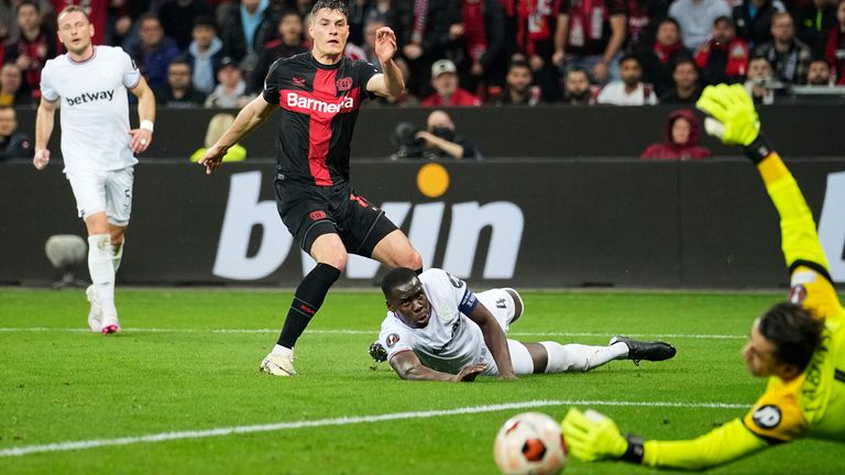 West Ham goalkeeper Lukasz Fabianski saves from Bayer Leverkusen's Patrik Schick during the first-half