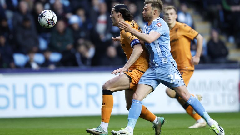 Coventry City's Matthew Godden (right) and Hull City's Jacob Greaves battle for the ball