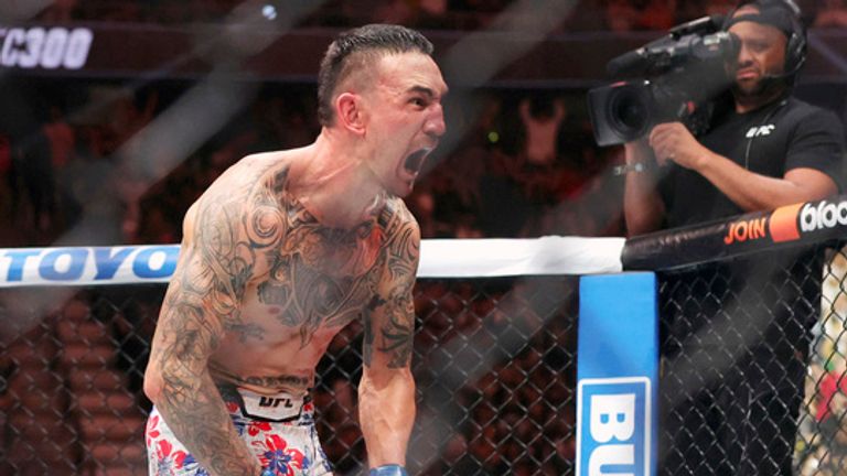 Max Holloway celebrates after knocking out Justin Gaethje in the fifth round of a lightweight bout during UFC 300 