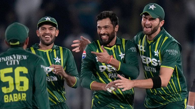 Pakistan's Mohammad Amir, second right, celebrates with teammates after taking the wicket of New Zealand's Tim Robinson during the second T20 international cricket match between Pakistan and New Zealand, in Rawalpindi, Pakistan, Saturday, April 20, 2024. (AP Photo/Anjum Naveed)