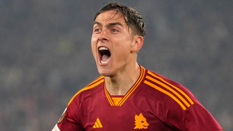 Roma's Paulo Dybala celebrates after scoring his team's second goal against AC Milan