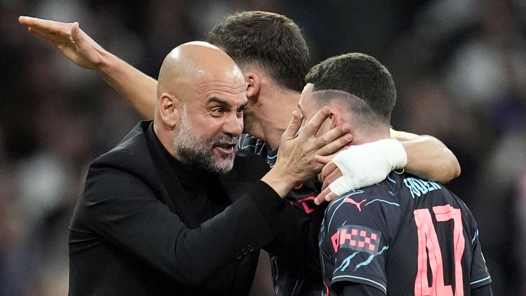 Phil Foden is congratulated by Pep Guardiola after his goal for Manchester City against Real Madrid