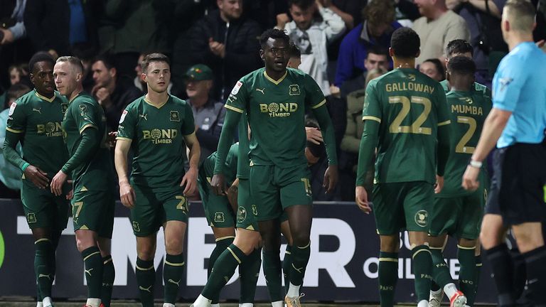 Plymouth Argyle's Mustapha Bundu (centre) celebrates with team-mates after scoring against Leicester