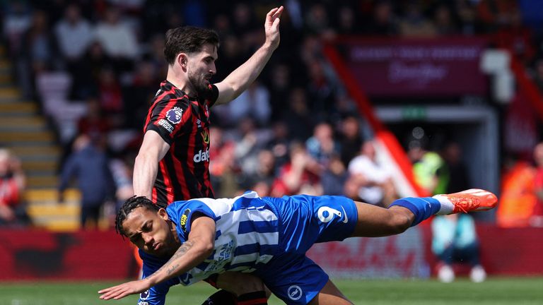 Joao Pedro takes a tumble after tangling with Lewis Cook