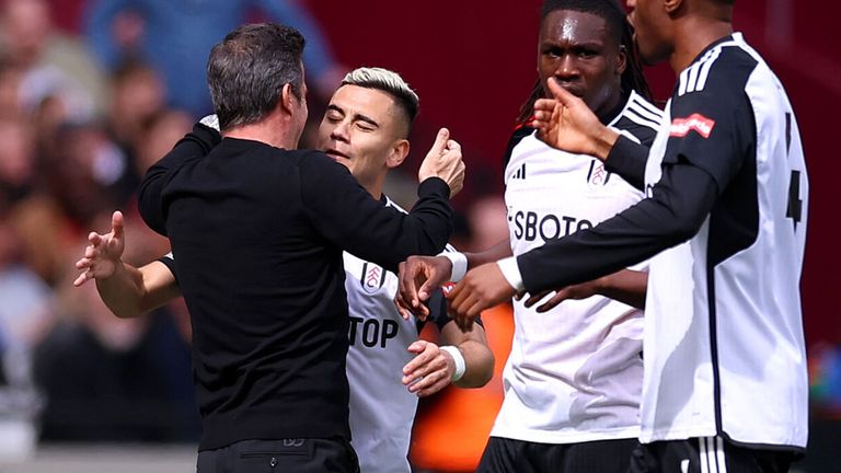 Andreas Pereira celebrates with manager Marco Silva after giving Fulham the lead at West Ham 