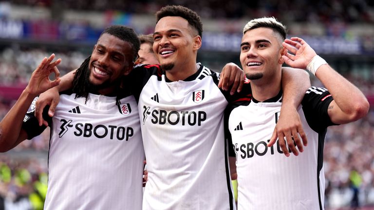 Andreas Pereira celebrates with team-mates Rodrigo Muniz and Alex Iwobi after giving Fulham a 2-0 lead at West Ham