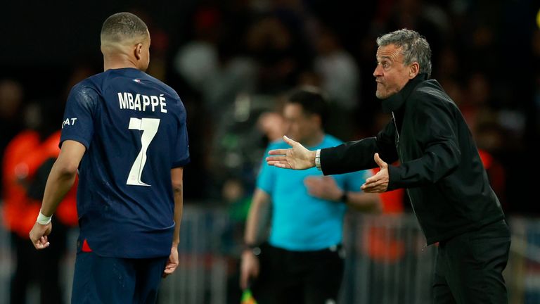 PSG's head coach Luis Enrique speaks with Mbappe