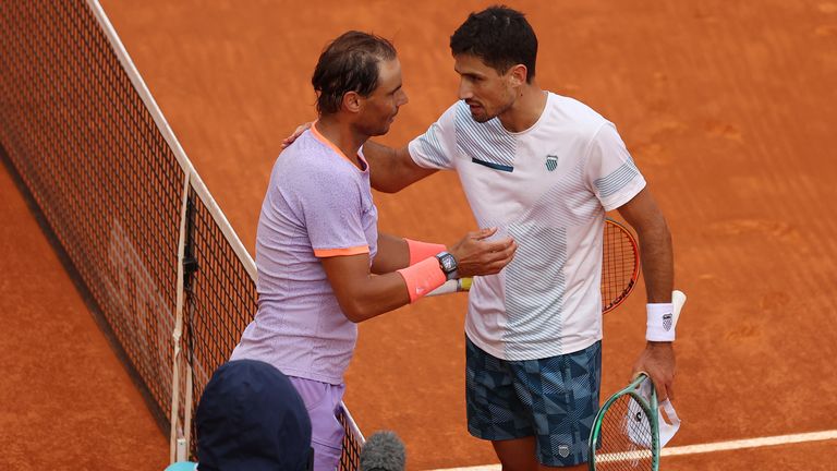Rafael Nadal of Spain and Pedro Cachin of Argentina embrace following their Men's Round of 32 match during day seven of the Mutua Madrid Open at La Caja Magica on April 29, 2024 in Madrid, Spain. (Photo by Clive Brunskill/Getty Images)