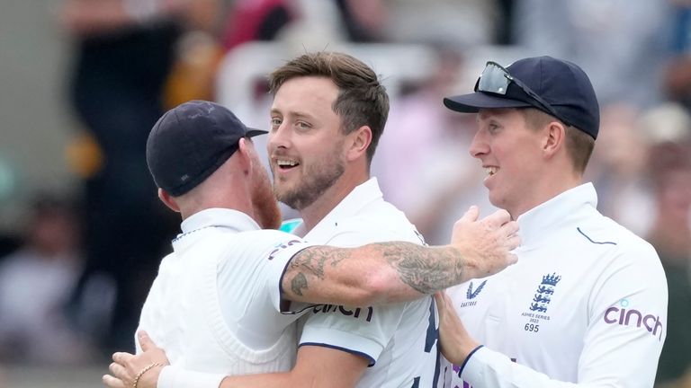 England's Ollie Robinson, centre, celebrates with teammates after dismissing Australia's Marnus Labuschagne during day one of the second Ashes Test cricket match at Lord's Cricket Ground, London, England, Wednesday, June 28, 2023. (AP Photo/Kirsty Wigglesworth)


