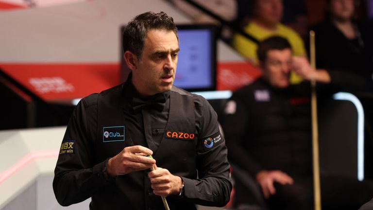 Ronnie O'Sullivan chalks the cue against Ryan Day in their round two match during day nine of the Cazoo World Snooker Championship 2024