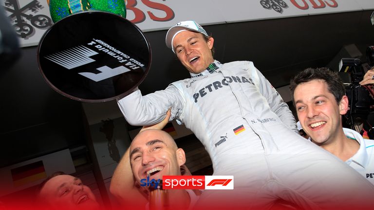 Mercedes Formula One driver Nico Rosberg of Germany is held aloft by his teammates as they celebrate his win at the Chinese Grand Prix in Shanghai, China, Sunday, April 15, 2012.