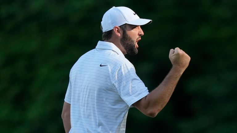 Scottie Scheffler celebrates after an eagle on the 13th 