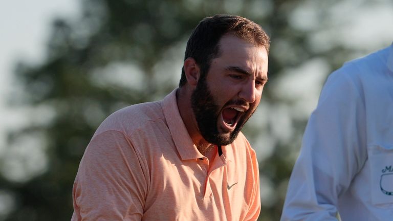 Scottie Scheffler celebrates his win at the Masters golf tournament at Augusta National Golf Club Sunday, April 14, 2024, in Augusta, Ga. (AP Photo/David J. Phillip)