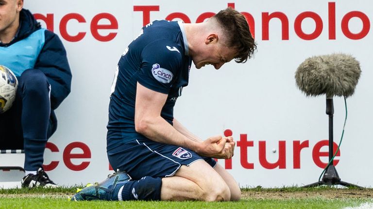 George Harmon sinks to his knees in celebration after giving Ross County a 2-1 lead against Rangers