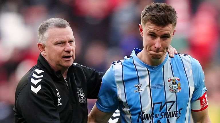 Coventry boss Mark Robins consoles captain Ben Sheaf, who missed a key spot-kick