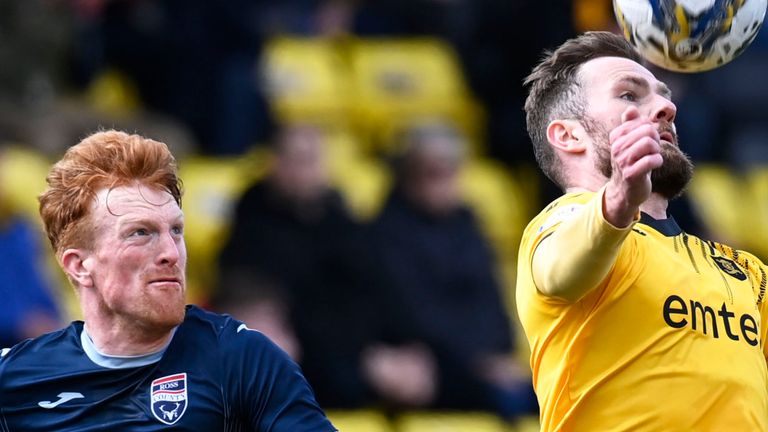 LIVINGSTON, SCOTLAND - APRIL 27: Ross County's Simon Murray and Livingston's Michael Devlin in action during a cinch Premiership match between Livingston and Ross County at Tony Macaroni Arena, on April 27, 2024, in Livingston, Scotland.  (Photo by Rob Casey / SNS Group)