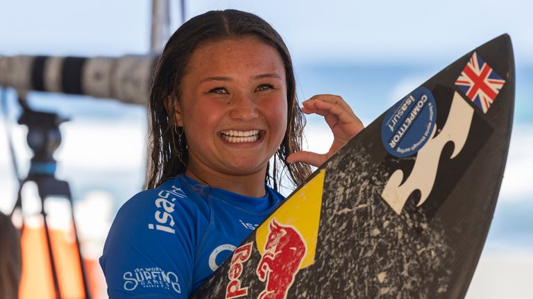 Sky Brown of Great Britain carries her board after competing in the ISA World Surfing Games, a qualifier for the Paris 2024 Olympic Games, at La Marginal beach in Arecibo, Puerto Rico, Thursday, Feb. 29, 2024. (AP Photo/Alejandro Granadillo)