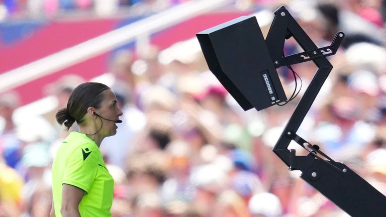 Referee Stephanie Frappart reviews the penalty decision before ruling it out