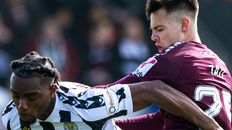 PAISLEY, SCOTLAND - APRIL 06: St Mirren's Toyosi Olusanya and Hearts Macauley Tait in action  during a cinch Premiership match between St Mirren and Heart of Midlothian at the SMiSA stadium, on April 06, 2024, in Paisley, Scotland. (Photo by Craig Williamson / SNS Group)