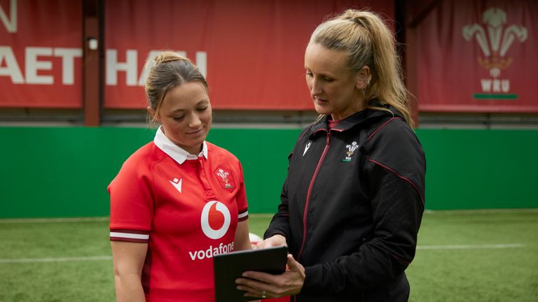 Flanker Alisha Joyce-Butchers (L) and Wales' head physiotherapist Jo Perkins (R) discuss the latest concussion feature