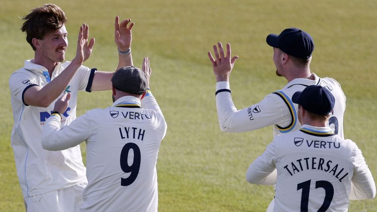 Yorkshire's George Hill celebrates after he takes the wicket of Leicestershire's Louis Kimber